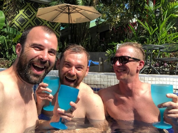 Guests enjoying drinks by the pool